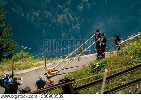 Schynige Platte, Bernese Oberland, Switzerland - August 1 2019 : High Angle View On 2 Alpenhorn Play