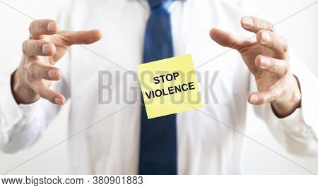Stop Violence Sign Inscription Text On Sticker Between Male Hands Of Businessman