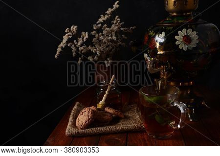 Tea Party In Rustic Style With Samovar
A Glass In Glass Holder, Honey And Cookies