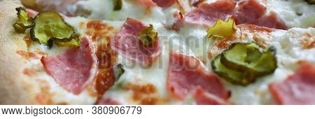 Close-up Of Homemade Delicious Round Shaped Pizza. Hot Yummy Salami Double Cheese Parmesan Tomatoes 