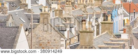 Old Croft Houses In Cullen, Fishing Village On Moray Firth, Scotland. Cullen Viaduct In The Backgrou