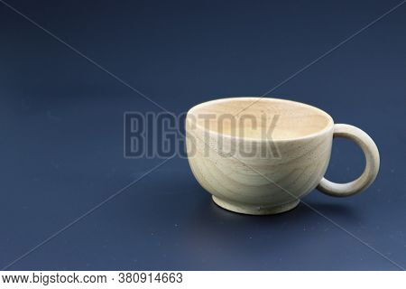 Empty white coffee cup on black color background