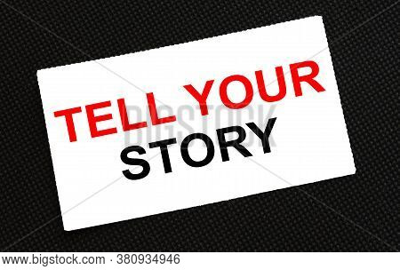 White Card On The Black Background With Text Tell Your Story