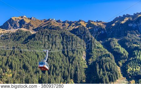 Cable Car Running Towards Mannlichen (maennlichen) From Wengen, Famous Tourist Destination In Swiss 