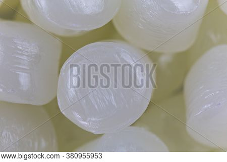 White Plastic Beads On Wood  Background, Polymers Bead Or Polymer Resin, Polymer Pallet, Product Fro
