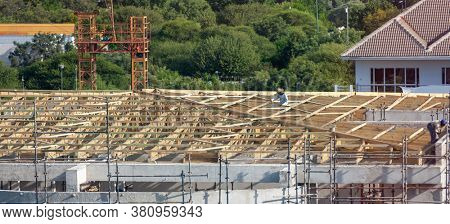 African workers working on a multistory construction site in the capital city of Botswana, Gaborone