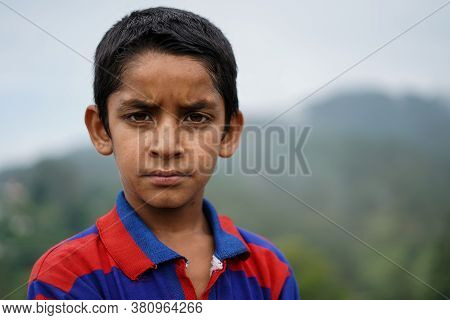 Portrait Of A Indian Pahadi Kid Who Belongs To The Mountains.