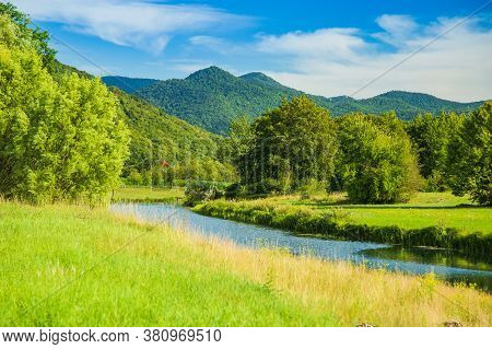 Beautiful Gacka River Flowing Between Green Fields, Summer View, Lika Region Of Croatia