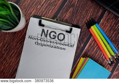 Ngo - Non-governmental Organization Text Write On A Paperwork Isolated On Office Desk.