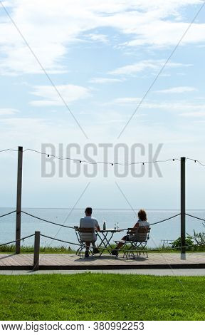 Criccieth / Wales / August 15 2020 : The Charming Welsh Seaside Resort Of Criccieth. Two Holiday Mak