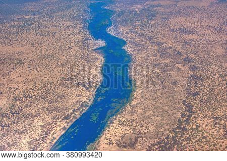 Botswana aerial river crossing an arid area, Maun, Okavango