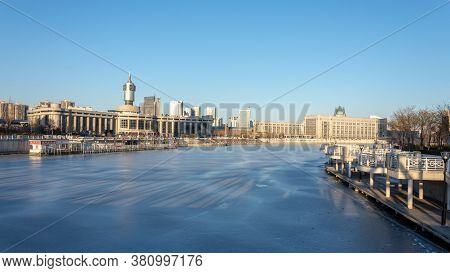 Tianjin / China - February 14, 2016: Frozen Hai River (haihe) In Central Tianjin, With Tianjin Railw