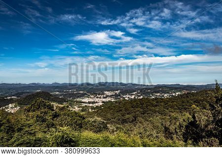 City View With Mountain Range And Bright Blue Sky From Hill Top At Day Image Is Taken From Doddabett