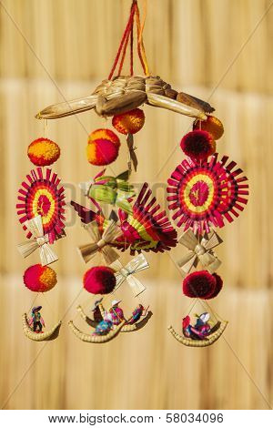 Souvenir from Uros island Peru Bolivia against blurry backgroundd