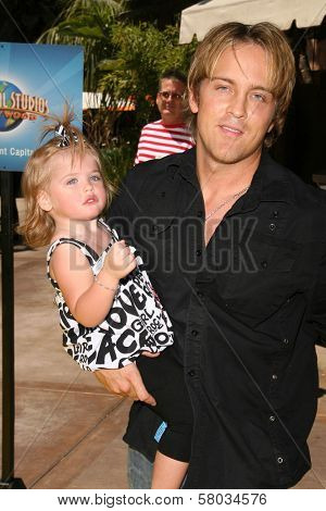 Larry Birkhead and daughter Dannielynn Smith  at the Grand Opening of 