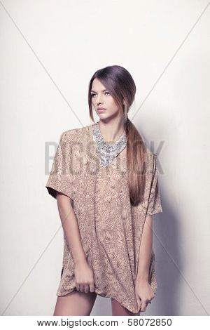 Beautiful high fashion model with necklace isolated on white background