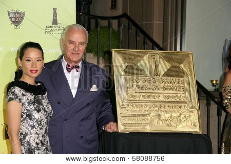 Lucy Liu and Manolo Blahnik  at the Rodeo Drive Walk of Style Award Gala. Rodeo Drive, Beverly Hills, CA. 09-25-08