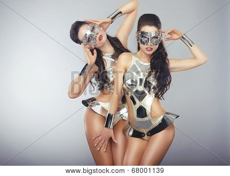 Vogue. People In Sparkling Cosmic Cyber Costumes Gesturing