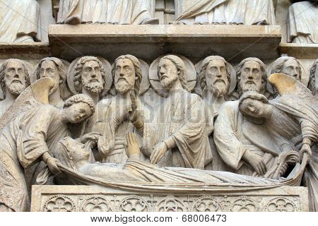 PARIS,FRANCE - NOV 05,2012:Death of the Virgin Mary,architectural details of Notre Dame cathedral.The Portal of the Virgin,dedicated to the patroness of the cathedral, was sculpted in the 1210s-1220s.