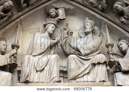 PARIS,FRANCE - NOV 05,2012:Coronation of the Virgin,architectural detail of Notre Dame cathedral.The Portal of the Virgin, dedicated to the patroness of the cathedral, was sculpted in the 1210s-1220s.