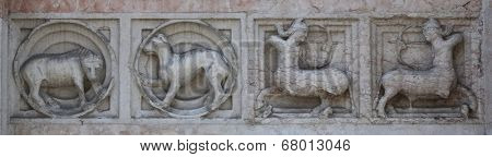 PARMA, ITALY - MAY 01, 2014: Detail of marble bass relief at the baptistry from Benedetto Antelami. Baptistery in Parma is considered to be among the most important Medieval monuments in Europe.