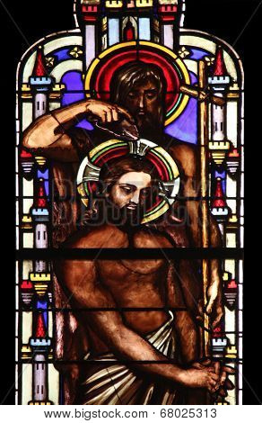 PARIS, FRANCE - NOV 11, 2012: Baptism of the Lord, stained glass from Church of St-Germain-l'Auxerr ois founded in the 7th century, was rebuilt many times over several centuries. 