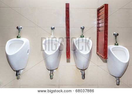 Line Of White Porcelain Urinals