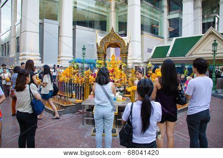 People Worship Brahma Statue