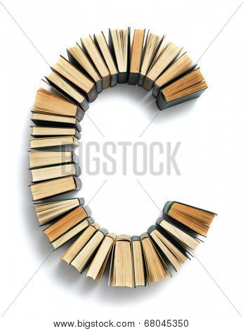 Letter B formed from the page ends of closed vintage hardcover books standing on a white background from a set or series of numbers