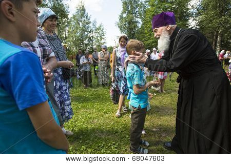 KRASNY BRONEVIK, RUSSIA - JULY 7, 2014: Celebrations commemorating the Rev. Anthony Dymsky (died 1224) in Antony Dymsky Monastery - Procession on Lake Dymsky, the great blessing of water and bathing.