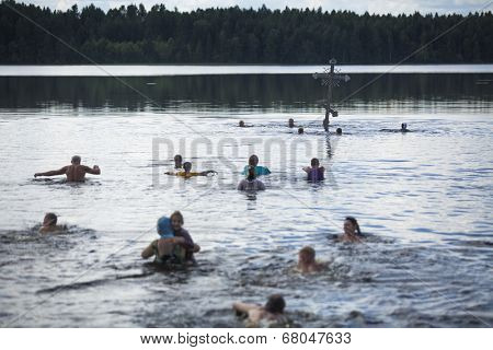 KRASNY BRONEVIK, RUSSIA - JULY 7, 2014: Celebrations commemorating the Rev. Anthony Dymsky (died 1224) in Antony Dymsky Monastery - Procession on Lake Dymsky, the great blessing of water and bathing.