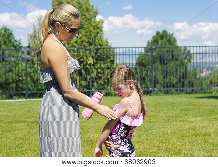 Mother Applying Sunscreen