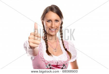 Happy Young Woman In A Dirndl Giving A Thumbs Up