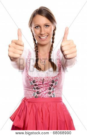 Happy Young Woman In A Dirndl Giving A Thumbs Up