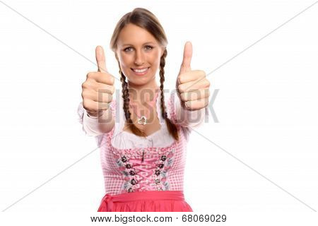 Happy Young Woman In A Dirndl Giving A Thumbs Up