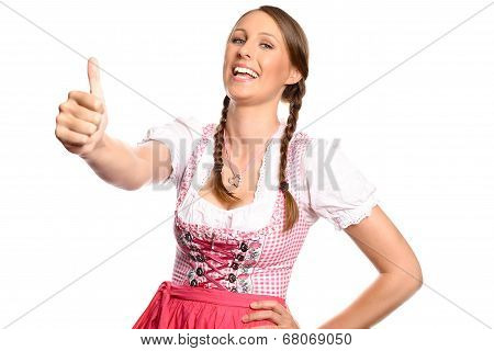 Happy Young Woman In A Dirndl Giving A Thumbs Up