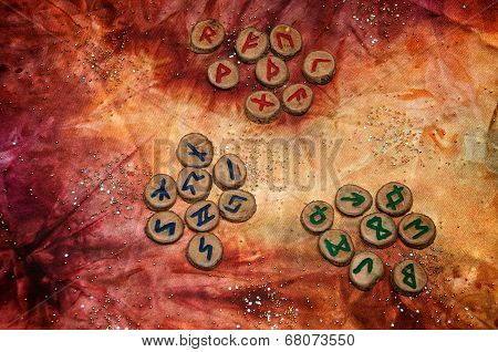 Three Sets Of Fortune Telling Runes On Colorful Mystical Cloth