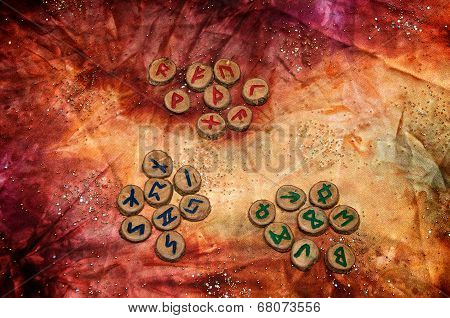 Three Sets Of Runes On Mottled Mystical Fabric