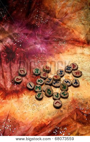 Wooden German Futhark Runes On Colorful Mystical Cloth