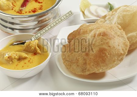 Indian Food: Kadhi with gatte and deep fried puri.