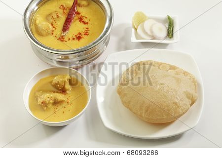 Indian Food: Kadhi with gatte and deep fried puri.