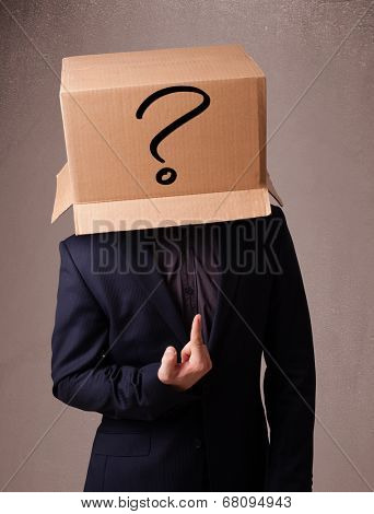 Young man standing and gesturing with a cardboard box on his head with question mark
