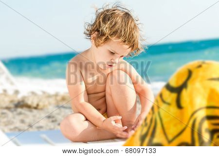 cute baby child on sea beack background
