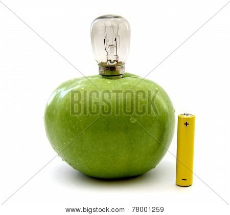 Green Apple With A Lamp And A Battery