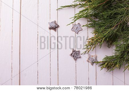 Spruce On Wooden Background.