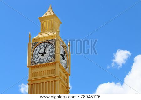 Yellow Layout Of Big Ben Tower On Blue Sky Background On Sunny Day Closeup