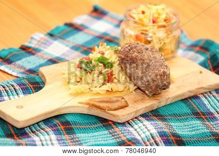 macaroni with cutlet and cabbage salad