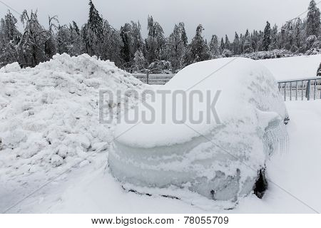 Frozen Parked Car With Icicles, Ice And Frost Covered With Snow