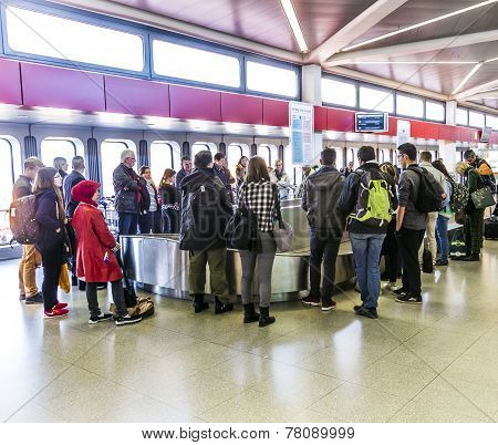 People Wait At Baggage Belt  In  Tegel Airport