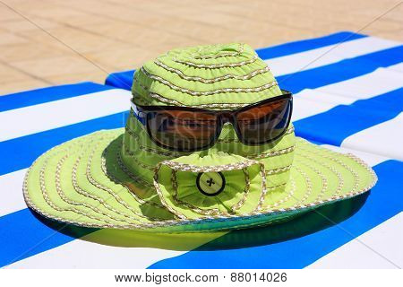 Hat With Sunglasses On A Lounger